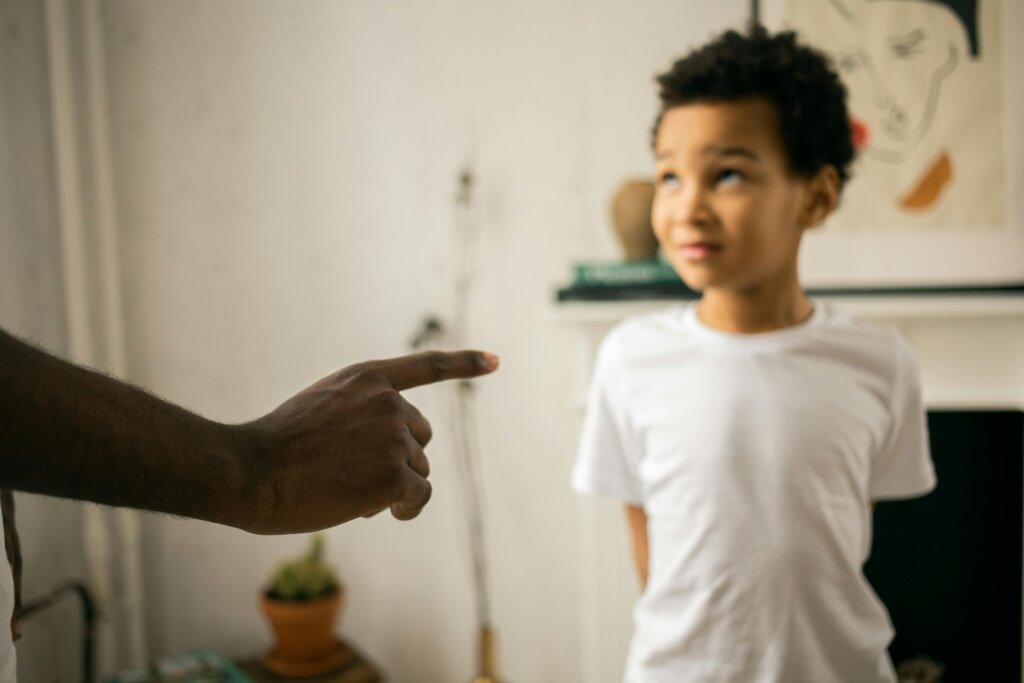 Kid telling a lie, being scolded to stop children from telling lies.